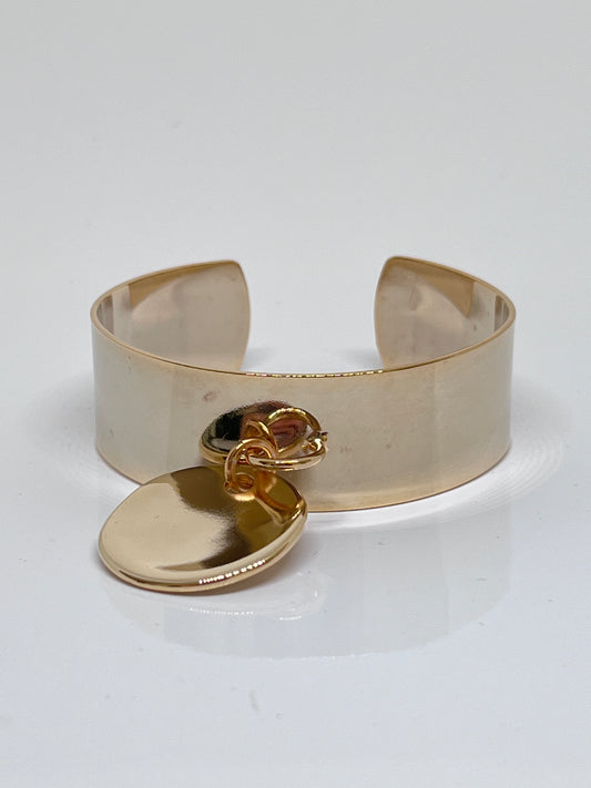 Manchette marine doré et médaille