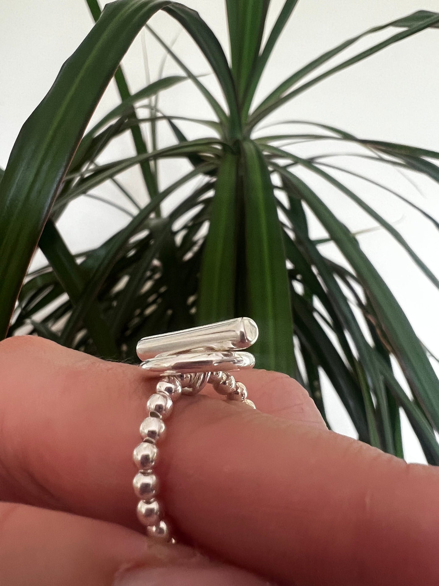 Bague perle 1 rang et fermoir T